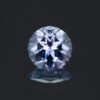 A 0.67 carat round blue-purple tanzanite.