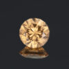 An image of a golden-peach garnet from Jeffrey Mine, Quebec, Canada