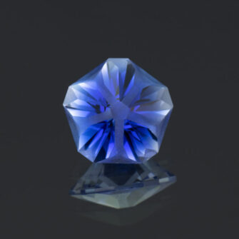 This is an image of a lab-created sapphire cut in the popular, but sometimes rare, Hanami cut.