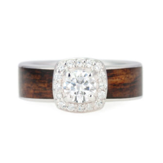 An image of a wooden engagement ring with diamonds and Caribbean rosewood.