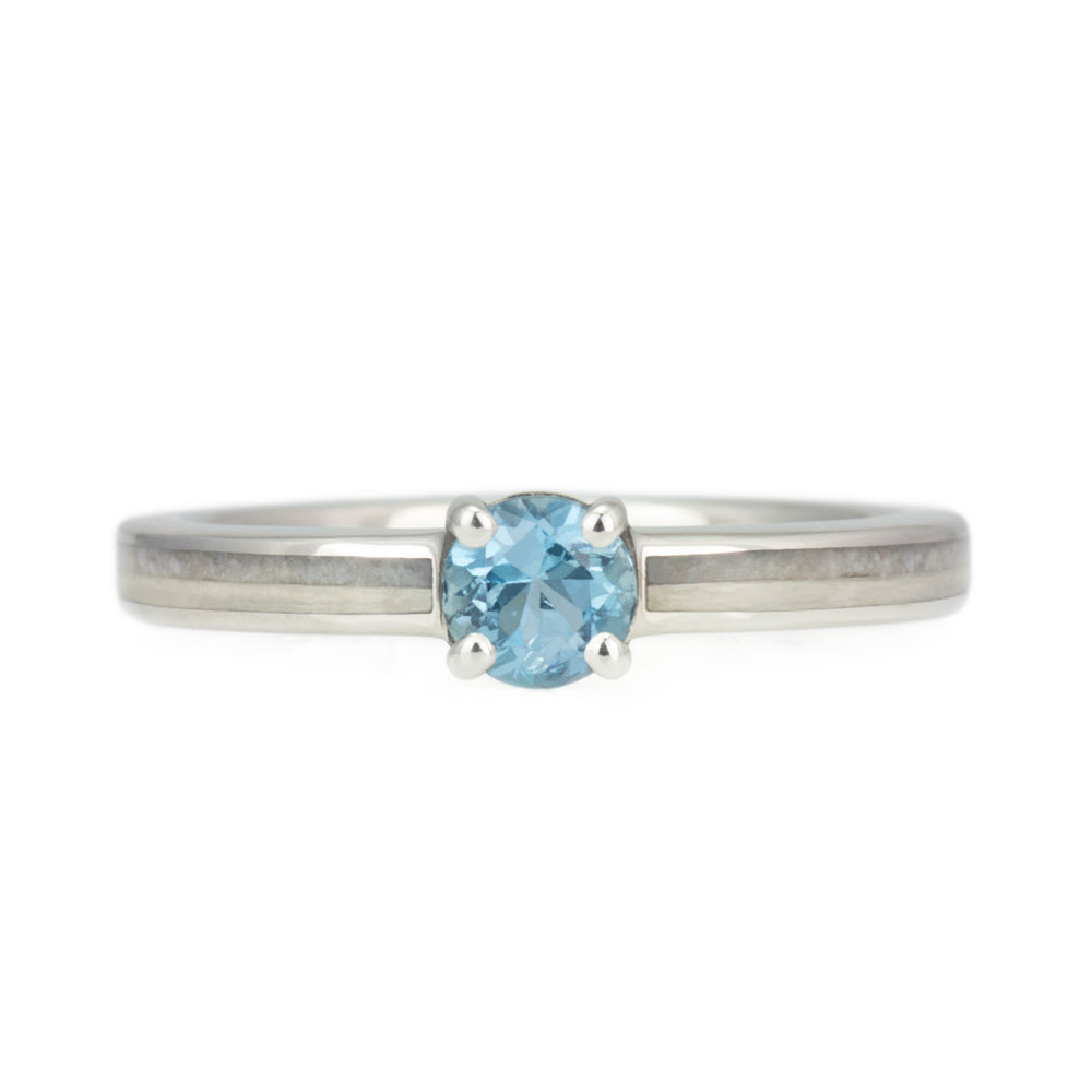 A custom aquamarine ring featuring customer-provided wood and rock, combining natural elements into a unique, handcrafted design.