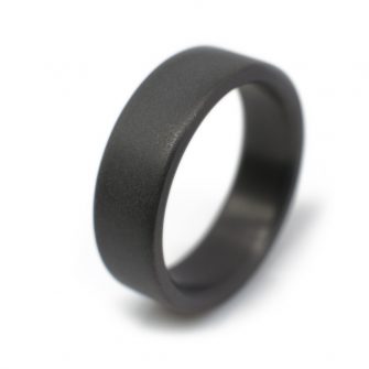 black wedding ring in zirconium