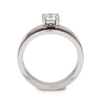 A profile view of a diamond wood engagement ring, made with a split shank.