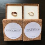 A pair of custom wood wedding rings made with elder and alder wood.