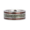 Close-up view of the intricate grain of koa wood and emerald inlay in this wood wedding band.