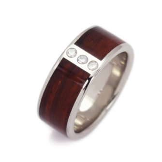 A wood wedding band for men with diamonds.