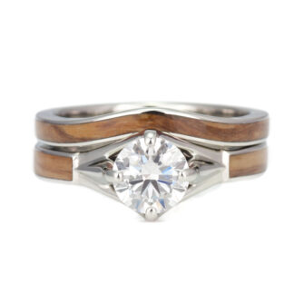 A stunning 1 carat diamond engagement ring set with a unique wooden band, showcasing timeless elegance and natural beauty.