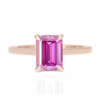 A picture of a pink emerald cut moissanite engagement ring.