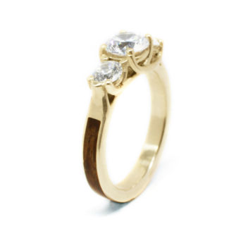 A picture of a rose wood engagement ring taken from the side.