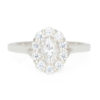 A picture of a Forever One oval cut moissanite engagement ring with diamond halo.