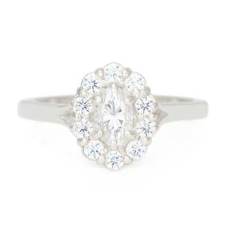 A picture of a Forever One oval cut moissanite engagement ring with diamond halo.