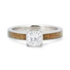 An image of a golden koa wood engagement ring.