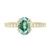 An image of a green oval cut moissanite engagement ring.