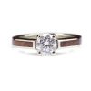 A low profile diamond engagement ring that is inlaid with wood