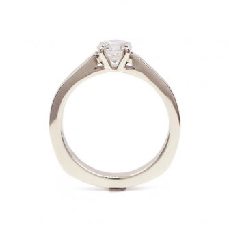 A profile image of a low set wood and diamond engagement ring
