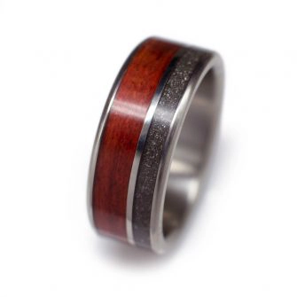 A man's wood ring made with titanium, bloodwood, and meteorite