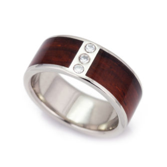 A 14k white gold ring inlaid with wood and diamonds.