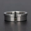A tension set diamond cube ring made in stainless steel.