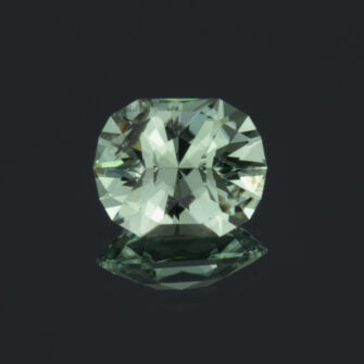 An image of a mint green tourmaline, custom faceted in house by us.