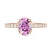 An image of a pink moissanite engagement ring in 14k rose gold.