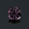 An image of a large deep purple spinel, square cut.