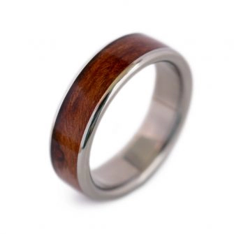 A wood wedding ring made with titanium and redwood.
