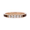An image of a 14k rose gold wedding ring inlaid with redwood