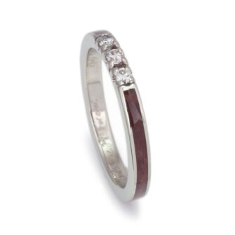 This rosewood wedding band with diamonds gleams in natural light, highlighting its organic beauty and fine diamonds.