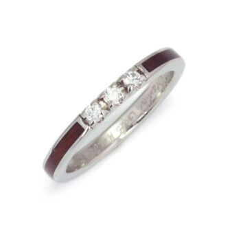 A rosewood wedding band paired with diamonds, illustrating the perfect match for couples seeking a unique symbol of their love.