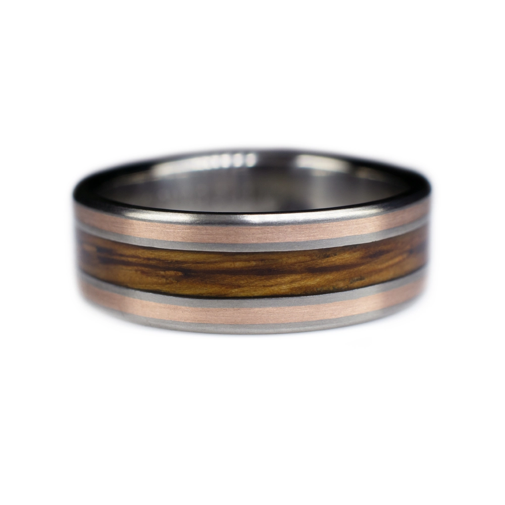 A custom made wooden ring for a customer that requested special rum barrel wood to be used in their ring