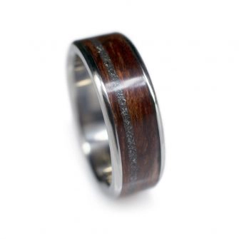 A man's wooden wedding ring made with bubinga wood and meteorite