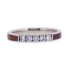 A women's wood wedding band with ancient kauri wood.