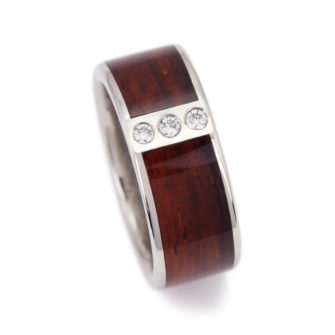 A wooden ring for men with diamonds.