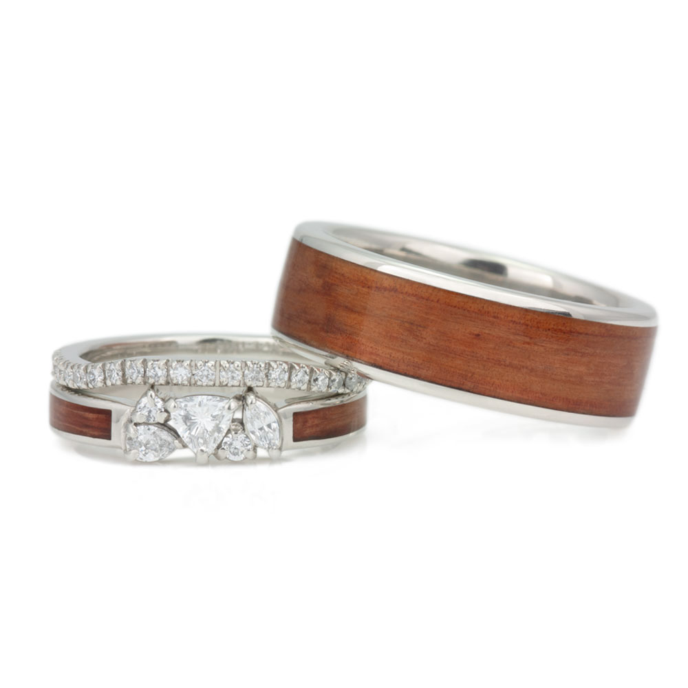 A image of a wooden engagement ring set, inlaid with customer-provided redwood.