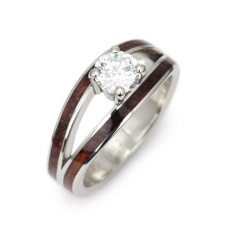 A picture of a split shank engagement ring inlaid with wood.