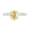 An image of an oval cut yellow moissanite engagement ring.