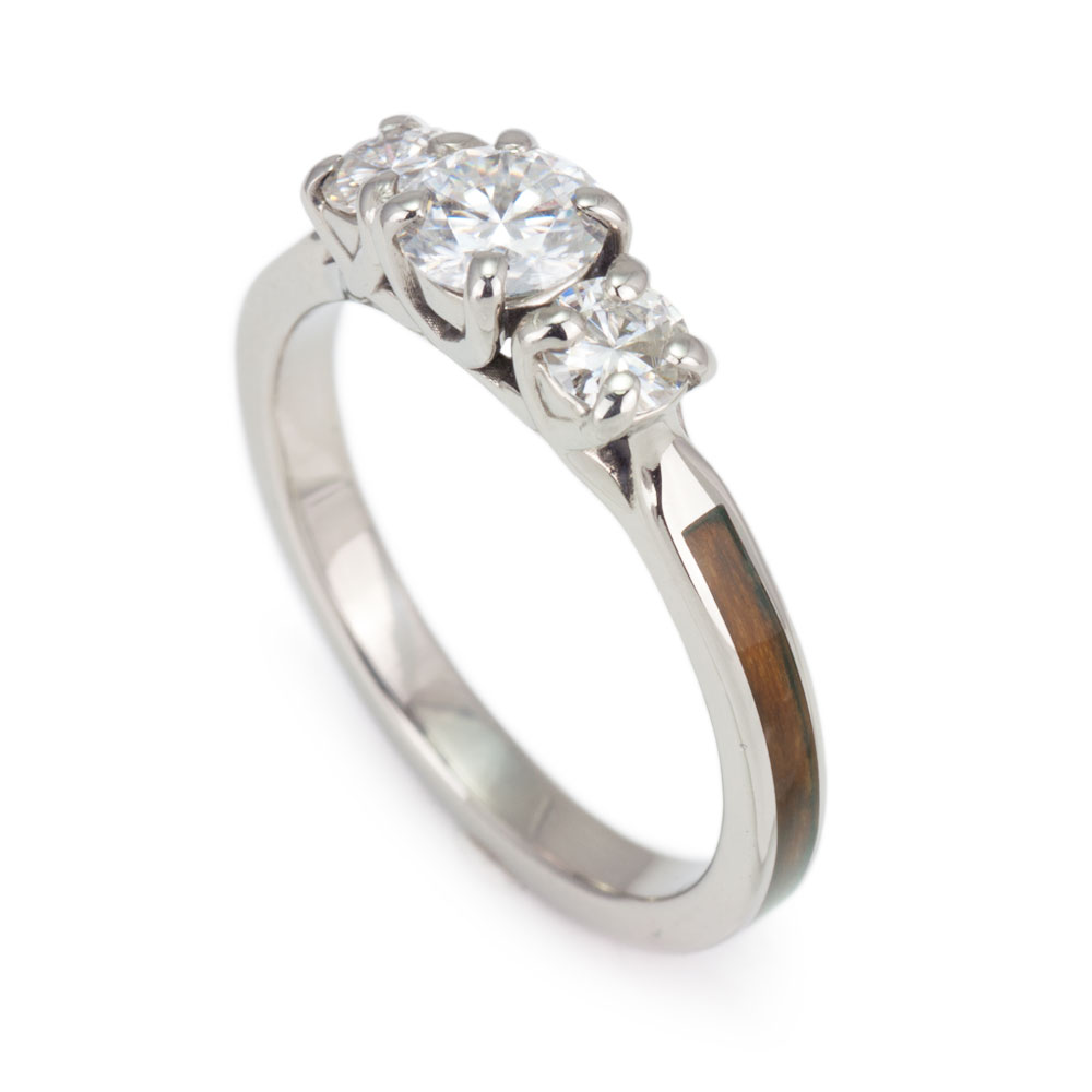 Yew wood engagement ring in 14k white gold with three diamonds.
