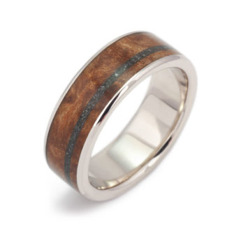 A gold ring made with wood and meteorite.
