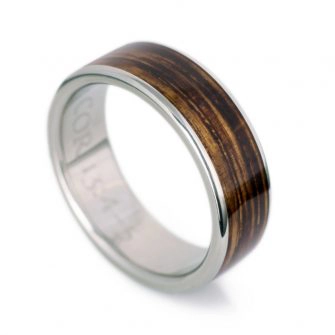 A picture of a titanium and Jack Daniel's whiskey barrel wood ring.