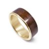 A men's wood ring made in 14k yellow gold.