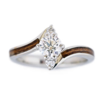 An image of a wooden engagement ring made with white gold.